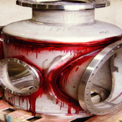 Industrial stainless steel component undergoing liquid penetrant inspection