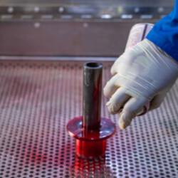 Technician performing liquid penetrant testing